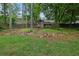 Backyard features a shed with a wooden fence and a grass covered backyard at 3470 Whisperwood Nw Ct, Marietta, GA 30064