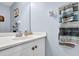 Bathroom featuring a white vanity with a marble countertop and a decorative striped towel at 3470 Whisperwood Nw Ct, Marietta, GA 30064