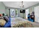 Bedroom featuring a queen bed, neutral tones, a ceiling fan and mounted television at 3470 Whisperwood Nw Ct, Marietta, GA 30064