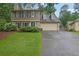 Charming two-story home featuring stone accents, a two-car garage, and a well-manicured front lawn at 3470 Whisperwood Nw Ct, Marietta, GA 30064