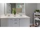 Bathroom featuring a double sink vanity with modern fixtures, ample storage, and contemporary decor at 585 Station View Run, Lawrenceville, GA 30043