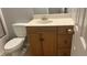 Bathroom featuring a single sink vanity with storage, mirror, and a toilet at 585 Station View Run, Lawrenceville, GA 30043