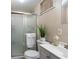 Cozy bathroom with glass-enclosed shower, neutral color palette, and modern fixtures, offering a comfortable space at 585 Station View Run, Lawrenceville, GA 30043