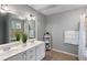 Bathroom featuring double sinks, decorative plants, and neutral tones creating a soothing and modern space at 585 Station View Run, Lawrenceville, GA 30043