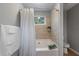 Well-lit bathroom with a shower-tub combination and modern fixtures, designed for comfort and functionality at 585 Station View Run, Lawrenceville, GA 30043