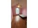 Bedroom with pink walls, wood floors, vaulted ceiling and window at 585 Station View Run, Lawrenceville, GA 30043
