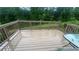 A spacious wooden deck offers an inviting outdoor living space with a weathered finish, perfect for relaxation at 585 Station View Run, Lawrenceville, GA 30043