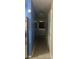 Hallway showcasing a side-by-side stainless steel refrigerator and access to the rear door at 585 Station View Run, Lawrenceville, GA 30043