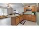 Open kitchen featuring an island, modern appliances, and ample natural light, designed for both cooking and gathering at 585 Station View Run, Lawrenceville, GA 30043
