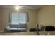 Comfortable living area with a sofa and window with blinds, offering a cozy atmosphere at 585 Station View Run, Lawrenceville, GA 30043