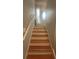 Staircase leading to the front door, creating an inviting entrance with warm lighting and decorative touches at 585 Station View Run, Lawrenceville, GA 30043