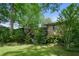Beautiful backyard with mature trees and lush greenery, offering a serene and private outdoor space at 2175 Fisher Ne Trl, Atlanta, GA 30345