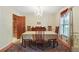 Dining room featuring a large table for entertaining and a chandelier, with hardwood floors and neutral colored walls at 2175 Fisher Ne Trl, Atlanta, GA 30345