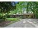 Charming single-story brick home featuring a well-manicured lawn and attached carport at 2175 Fisher Ne Trl, Atlanta, GA 30345