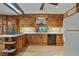Traditional kitchen features wooden cabinets, countertops, tile backsplash, and stainless steel appliances at 2175 Fisher Ne Trl, Atlanta, GA 30345