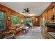 Bright sunroom with wood paneling, lots of natural light, and comfortable seating at 2175 Fisher Ne Trl, Atlanta, GA 30345