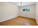Bedroom features hardwood floors, ceiling fan and a window for natural light at 2315 Tuxedo Se Dr, Marietta, GA 30067