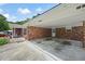 Attached brick carport with covered parking space and direct access to the house at 2315 Tuxedo Se Dr, Marietta, GA 30067