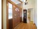 Entryway featuring hardwood floors, a wooden front door with glass panels, and a grandfather clock at 2315 Tuxedo Se Dr, Marietta, GA 30067