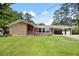 Charming single story home with brick and stone details, well-maintained lawn, and covered carport at 2315 Tuxedo Se Dr, Marietta, GA 30067