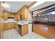 Bright eat in kitchen featuring white tile floors and wood cabinets at 2315 Tuxedo Se Dr, Marietta, GA 30067