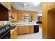 Well-lit kitchen featuring wooden cabinets, tile flooring, and modern appliances at 2315 Tuxedo Se Dr, Marietta, GA 30067