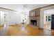 Bright living room with hardwood floors, a brick fireplace, and access to other rooms at 2315 Tuxedo Se Dr, Marietta, GA 30067