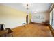 Spacious living room featuring hardwood floors, yellow walls, and floral accents at 2315 Tuxedo Se Dr, Marietta, GA 30067