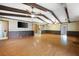 Open concept living room featuring hardwood floors, beamed ceiling and lots of light at 2315 Tuxedo Se Dr, Marietta, GA 30067