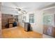 Office space with brick wall, wood floors, natural light, desk and adjacent sunroom at 2315 Tuxedo Se Dr, Marietta, GA 30067