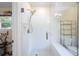 Modern shower with glass door, tiled walls, and convenient shower head features at 2315 Tuxedo Se Dr, Marietta, GA 30067