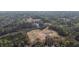 A stunning aerial view captures the community, which is surrounded by lush forests at 2701 Montie Ct, Lithia Springs, GA 30122