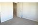 Bright bedroom features neutral carpet, a door to the ensuite bathroom, and great natural light at 2701 Montie Ct, Lithia Springs, GA 30122