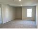 Well-lit bedroom with carpet flooring and neutral paint, offering a relaxing atmosphere at 2701 Montie Ct, Lithia Springs, GA 30122