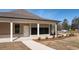 Community mailbox and entrance to the building are located near landscaped front yard at 2701 Montie Ct, Lithia Springs, GA 30122