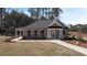 Inviting one-story home with well-manicured lawn and a welcoming walkway to the front door at 2701 Montie Ct, Lithia Springs, GA 30122