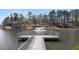 Lakeside view of community recreational pond with a fountain and a viewing platform with handrails at 2701 Montie Ct, Lithia Springs, GA 30122