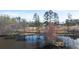 A serene pond with surrounding trees offers a tranquil escape within the community at 2701 Montie Ct, Lithia Springs, GA 30122