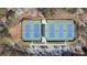 Aerial view of well-maintained community tennis courts, parking, and surrounding green space at 2701 Montie Ct, Lithia Springs, GA 30122