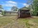 Backyard featuring a screened-in porch and lush green grass at 6026 Woodcreek Dr, Woodstock, GA 30188