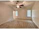 Main bedroom features vaulted ceilings, windows and neutral carpet at 6026 Woodcreek Dr, Woodstock, GA 30188