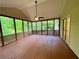 Large screened-in porch, perfect for enjoying the outdoors in comfort and privacy at 6026 Woodcreek Dr, Woodstock, GA 30188