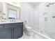 Modern bathroom featuring a glass shower, gold hardware, and marble floors and countertops at 661 Auburn Ne Ave # 10, Atlanta, GA 30312