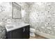 Stylish powder room featuring floral wallpaper, a modern vanity, and elegant fixtures at 661 Auburn Ne Ave # 10, Atlanta, GA 30312