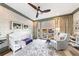 Bright Bedroom with a crib, large windows, and ceiling fan at 661 Auburn Ne Ave # 10, Atlanta, GA 30312