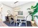 Elegant dining room with a rustic wooden table, chandelier, and stylish decor at 661 Auburn Ne Ave # 10, Atlanta, GA 30312