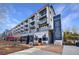 Multi-story building with street level dining and modern architectural design in urban area at 661 Auburn Ne Ave # 10, Atlanta, GA 30312
