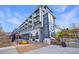 Street-level view of multi-story building featuring retail space and vibrant public art at 661 Auburn Ne Ave # 10, Atlanta, GA 30312