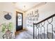 Light-filled foyer with hardwood floors, staircase, and gallery wall at 661 Auburn Ne Ave # 10, Atlanta, GA 30312