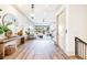 Spacious hallway with hardwood floors, modern decor, and a view into the living room at 661 Auburn Ne Ave # 10, Atlanta, GA 30312
